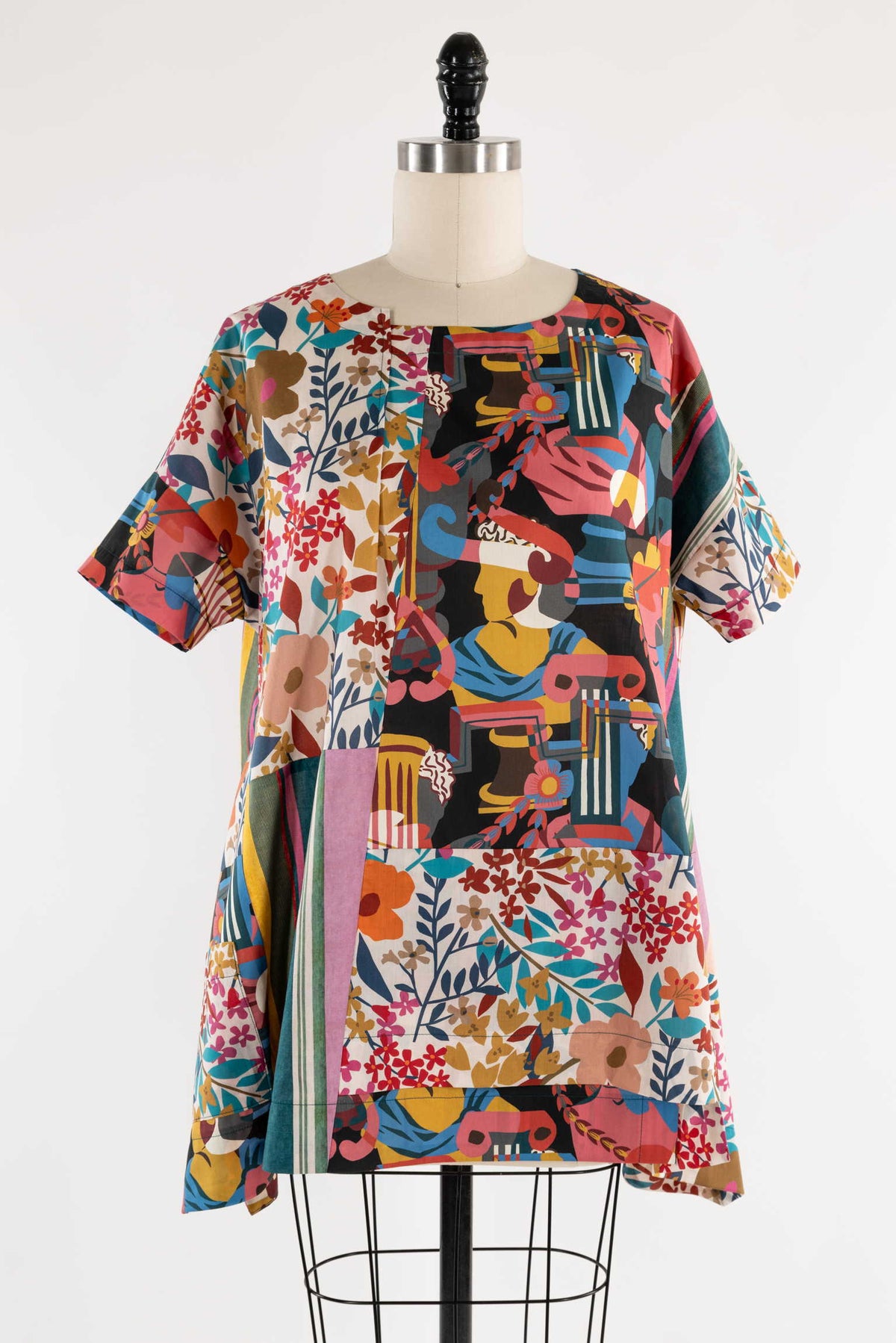 Colorful patchwork tunic with floral and abstract prints, ideal for creative sewing projects