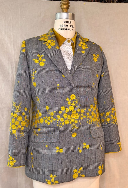 Gray plaid blazer with yellow floral print, styled on mannequin for sewing or fashion design