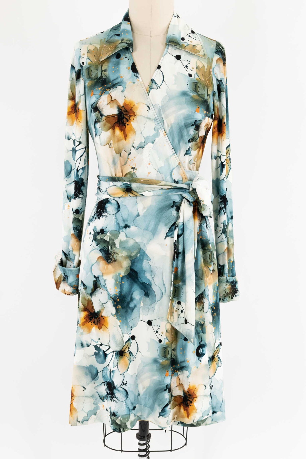 Watercolor floral wrap dress in blue, white, and rust tones, perfect for sewing apparel projects