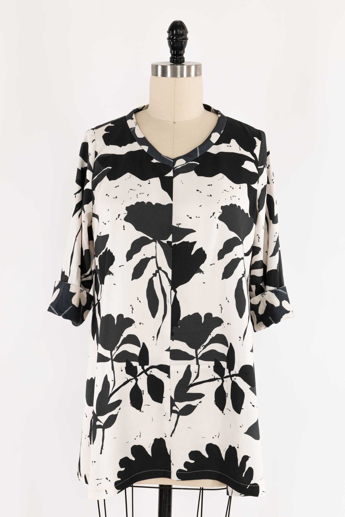 Black and white floral print dress on mannequin, ideal for sewing apparel or quilting projects
