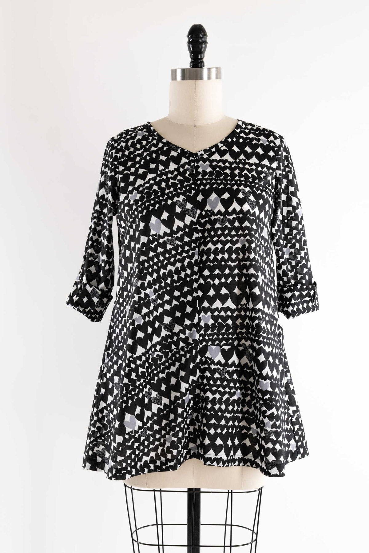 Black and white heart patterned dress with 3/4 sleeves on mannequin