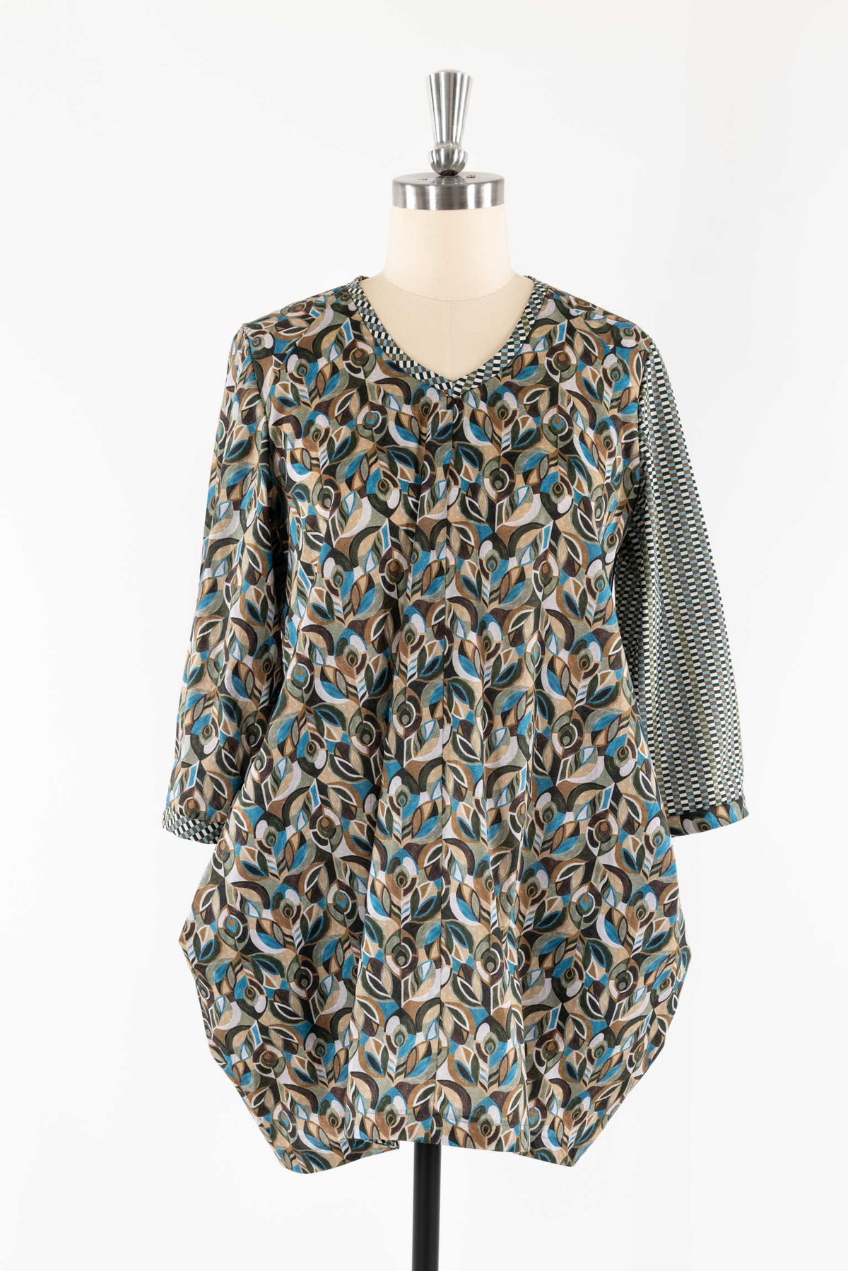 Abstract leaf print tunic with checkered sleeves, ideal for sewing apparel and creative fashion projects.