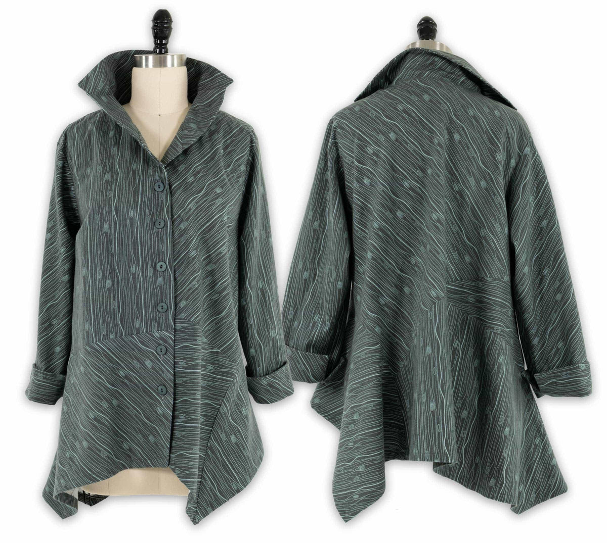Dark green abstract print tunic with button front, asymmetrical hem, and cuffed sleeves on mannequin