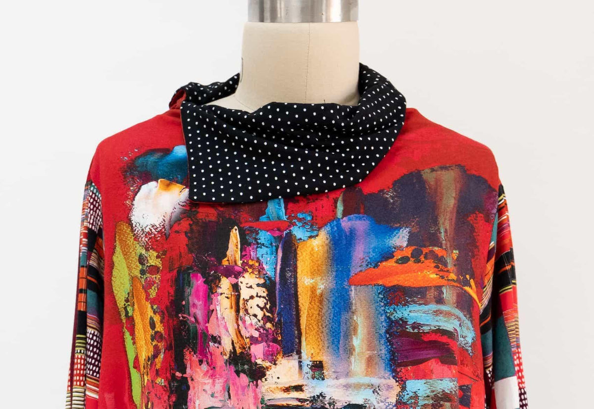 Vibrant abstract print top with black polka dot cowl neck, ideal for creative sewing projects