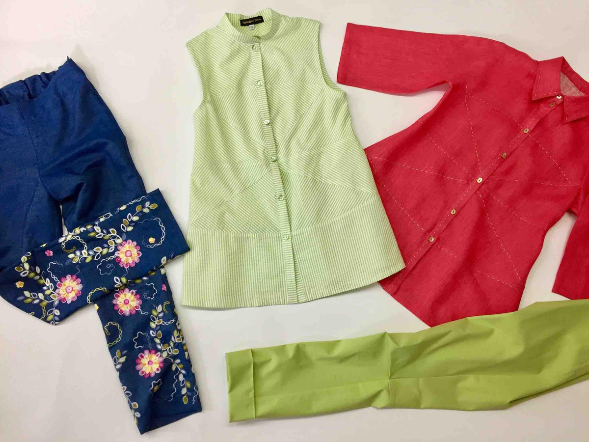 Handmade apparel set: striped green vest, red shirt, floral blue pants, lime green skirt — ideal for sewing projects
