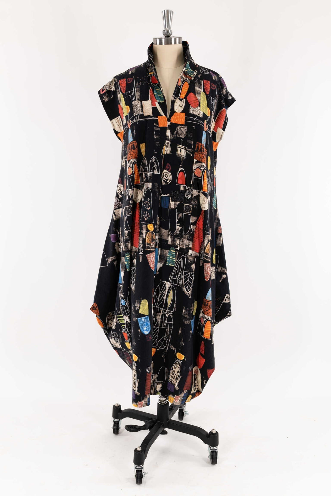 Black abstract print dress with geometric shapes, displayed on mannequin for sewing and fashion design