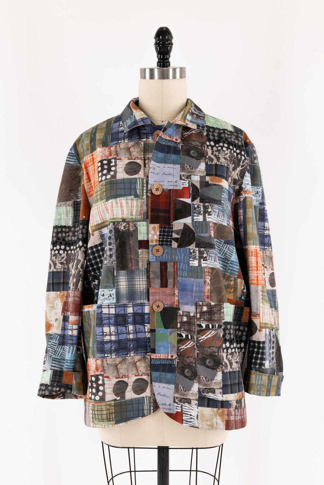 Patchwork shirt with abstract geometric print, button-front, long sleeves, displayed on mannequin
