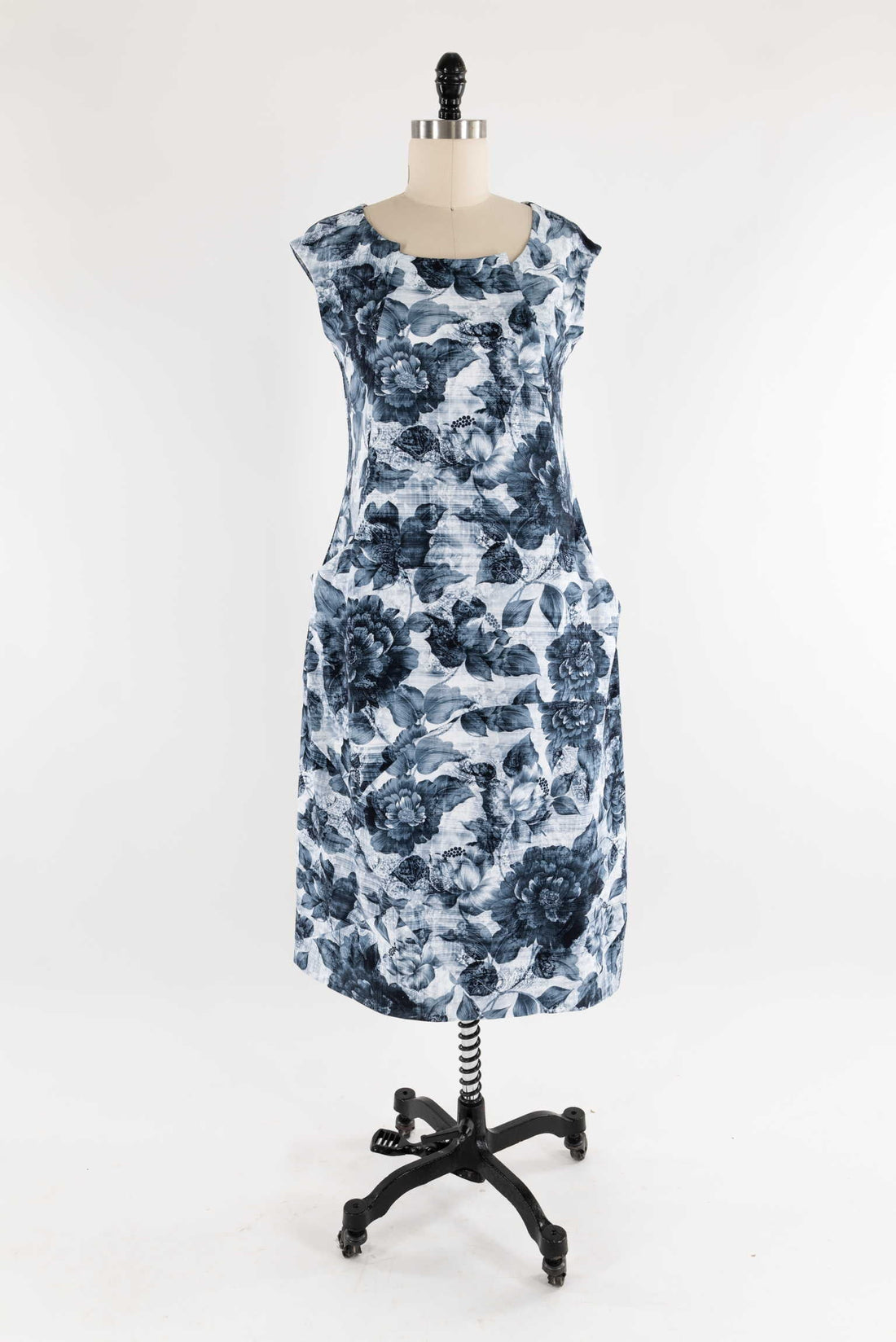 Blue floral print dress on mannequin, ideal for sewing apparel with cotton or linen fabric