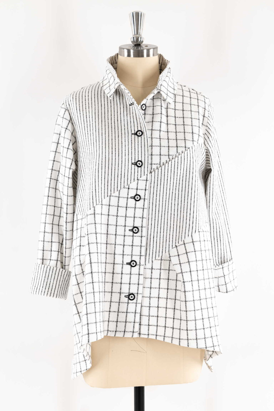 Black and white grid pattern shirt with button front, displayed on mannequin for sewing projects