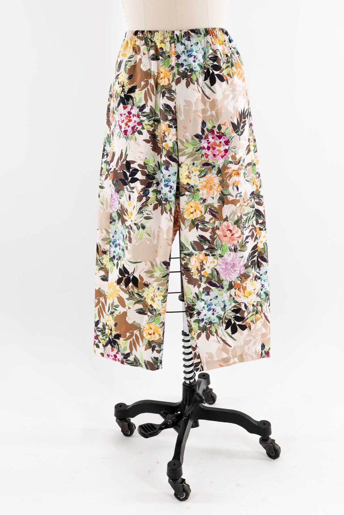 Floral print wide-leg pants on mannequin, ideal for sewing apparel with cotton or rayon fabric