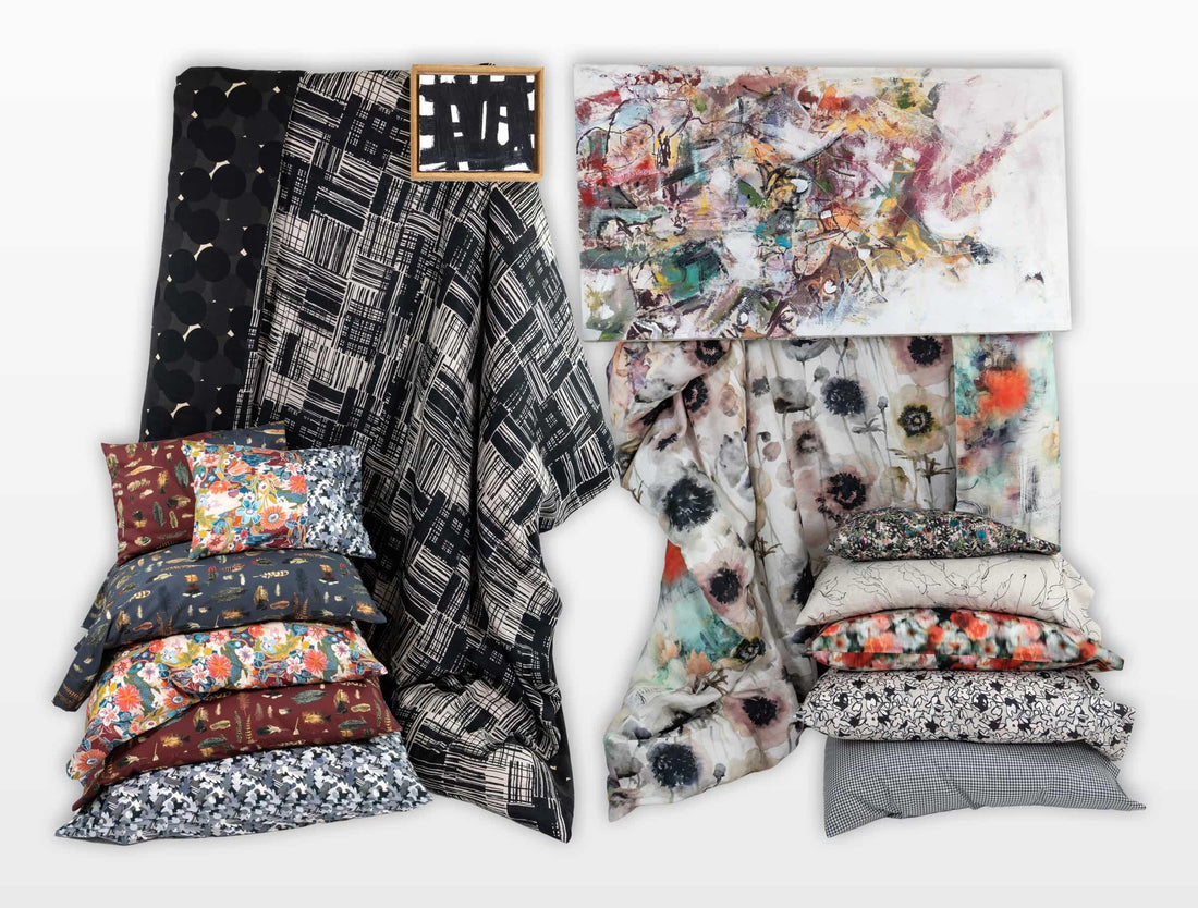 Floral, geometric, and abstract fabric collections with decorative pillows and art, ideal for sewing and home decor