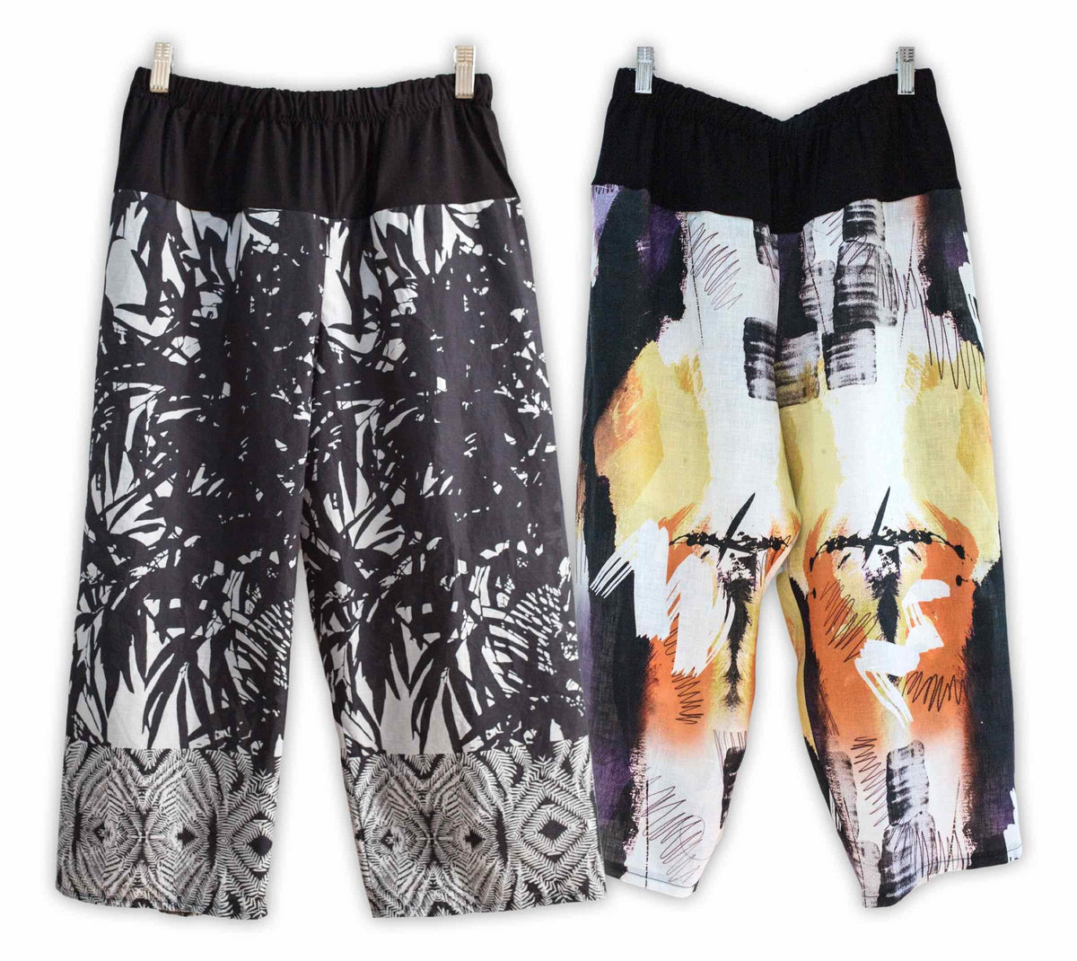 Two pairs of wide-leg pants with abstract prints and elastic waistbands, ideal for sewing projects