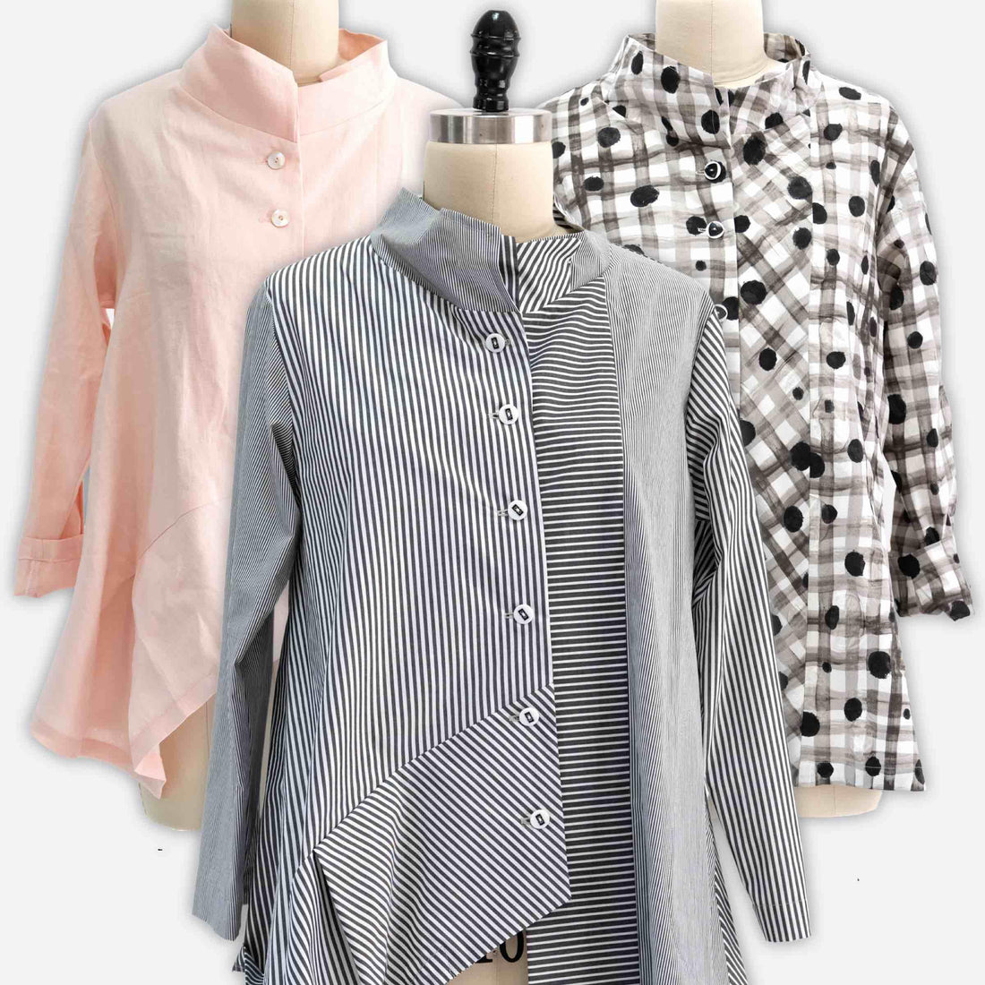 Striped, polka dot, and solid button-up shirts on mannequins for sewing and fashion design