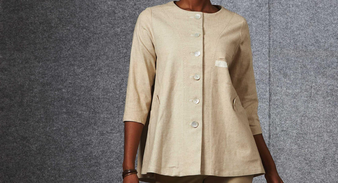 Beige linen button-up tunic with patch pockets, ideal for sewing apparel and fashion projects