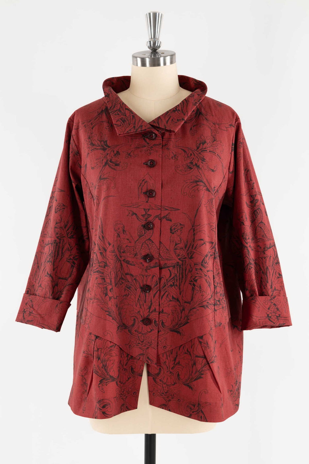 Red floral print button-up blouse with rolled sleeves and asymmetrical hem