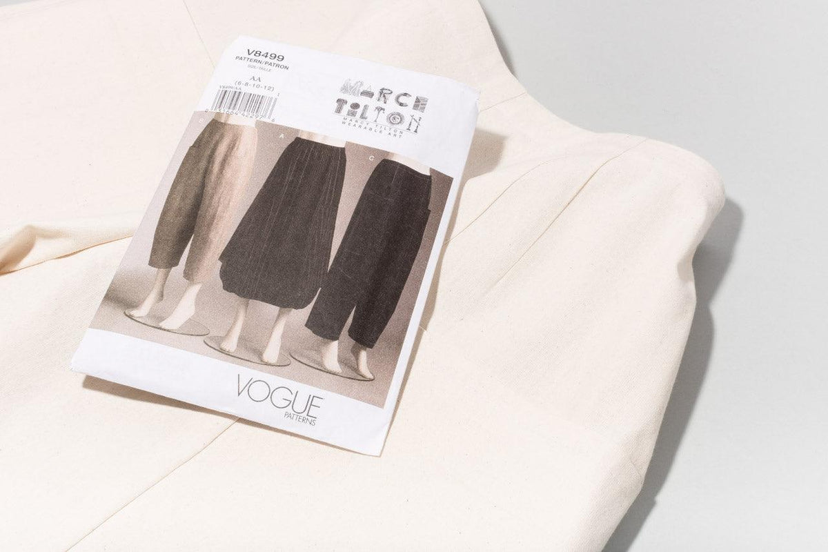 Marcy Tilton V8499 Vogue sewing pattern for women's pants and skirt on natural fabric