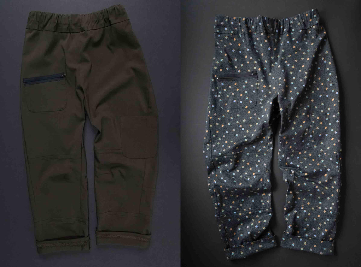 Olive green and polka dot patterned pants with elastic waist and zip pockets, ideal for sewing projects