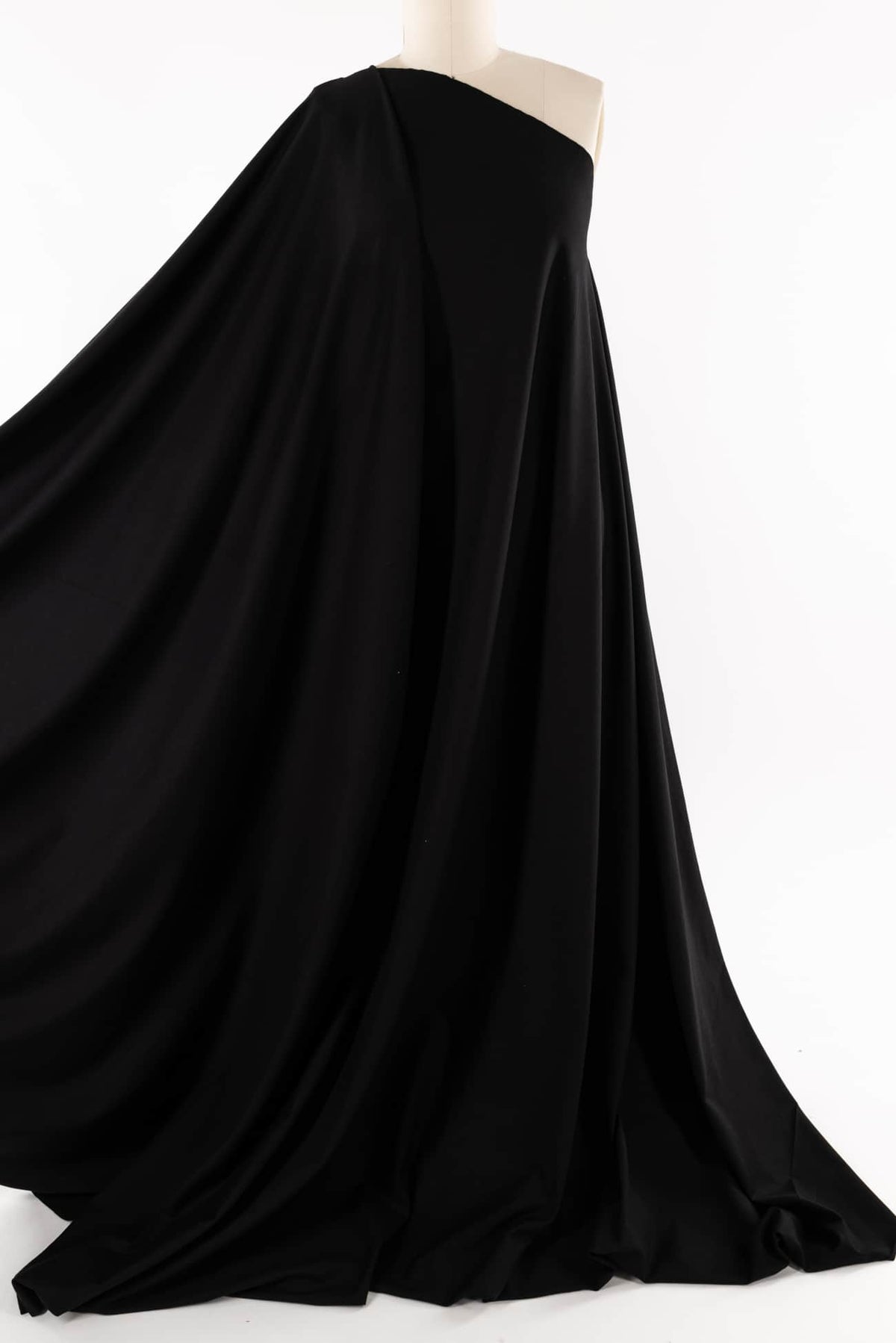 Black drape fabric on mannequin, ideal for apparel sewing and fashion design projects