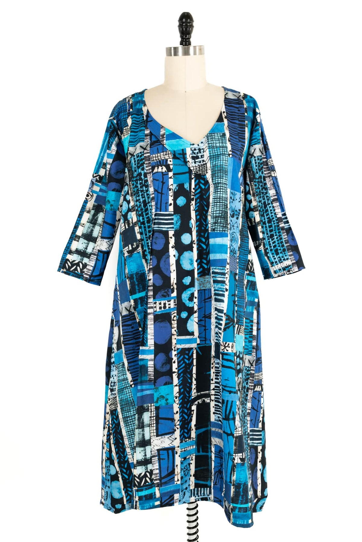 Blue abstract print dress with geometric patterns, ideal for creative sewing projects using fashion fabrics.