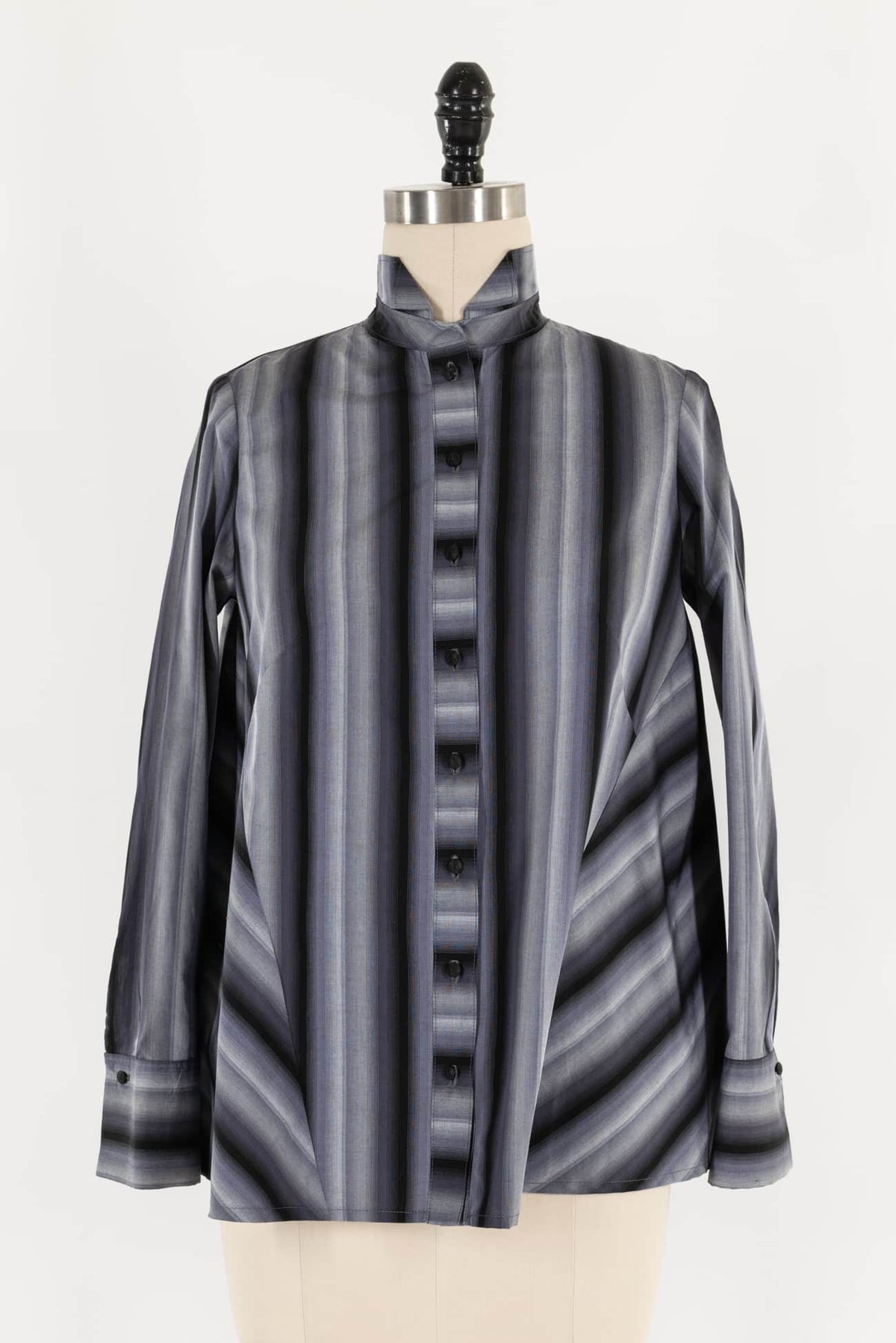 Gray striped button-up blouse with stand collar, displayed on mannequin for sewing projects