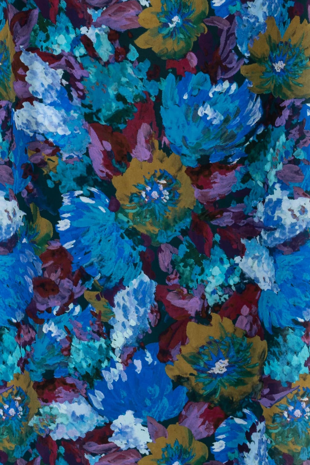 Vibrant floral print fabric with bold blue, purple, and gold blooms for apparel sewing