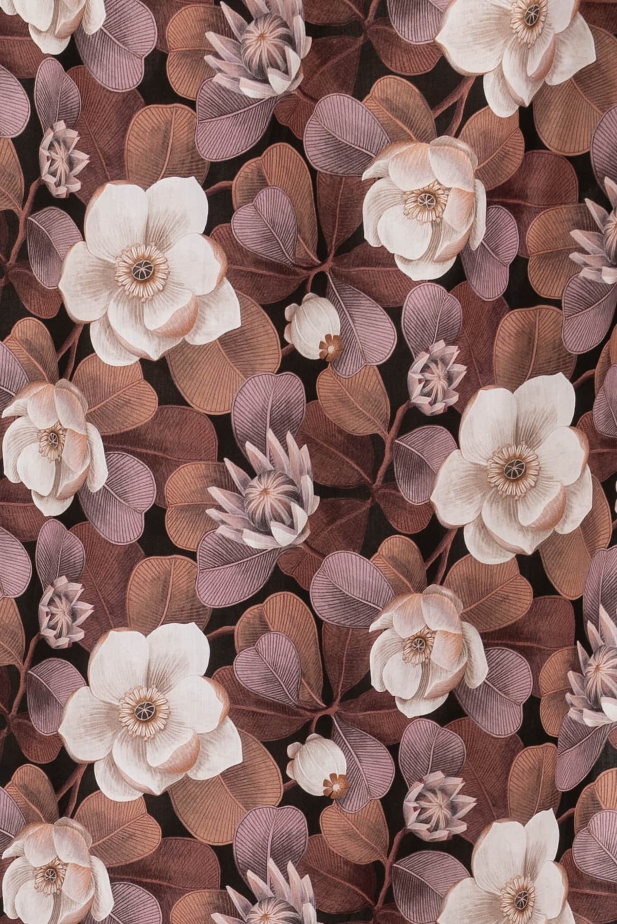 Elegant floral fabric with cream magnolias and mauve leaves on dark background, ideal for apparel sewing