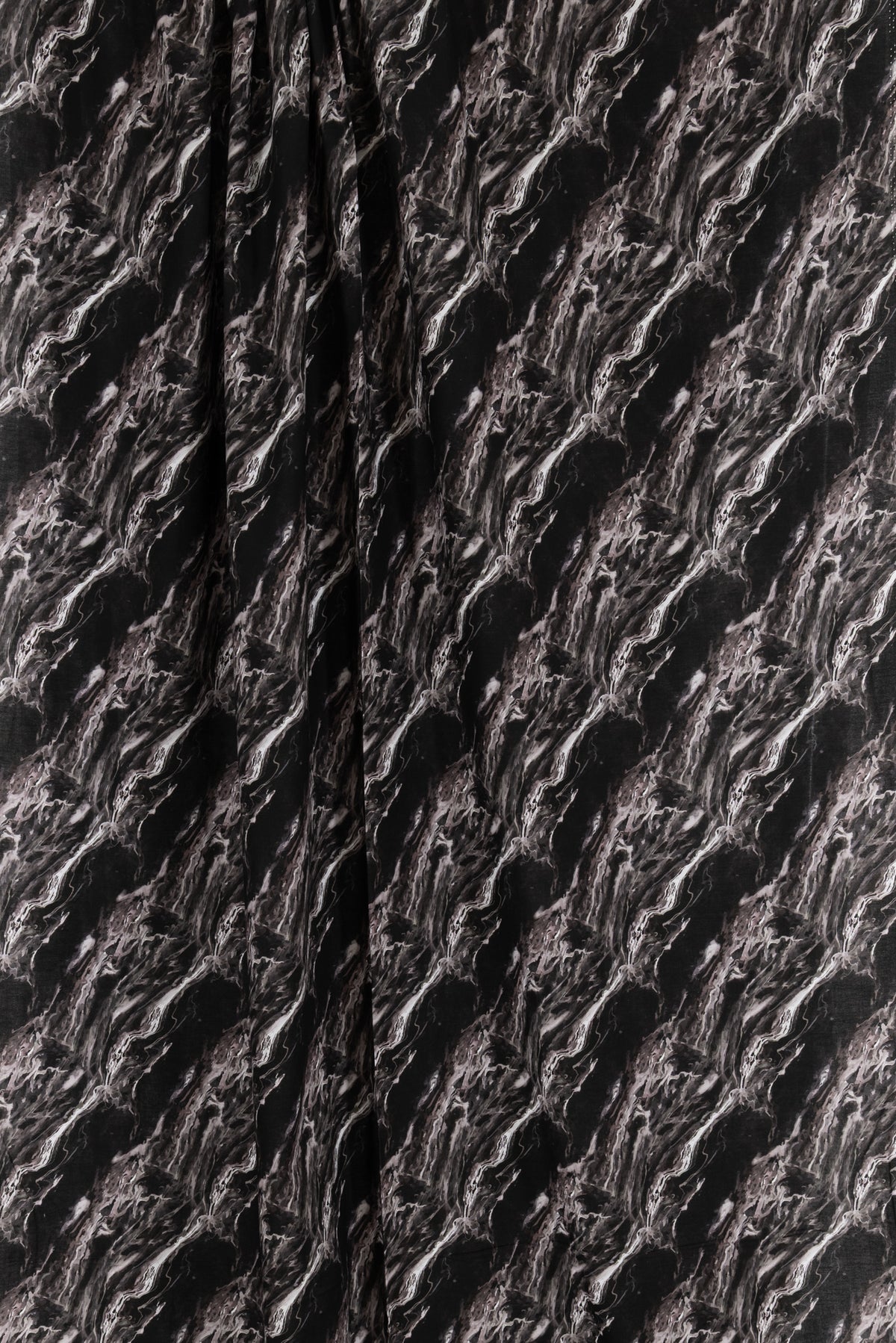 Black and white marble print fabric for apparel sewing, featuring abstract swirls and textured design