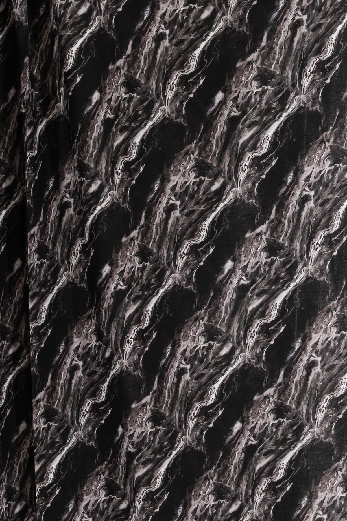 Black and white marble print fabric for apparel sewing, featuring abstract fluid patterns and textured design