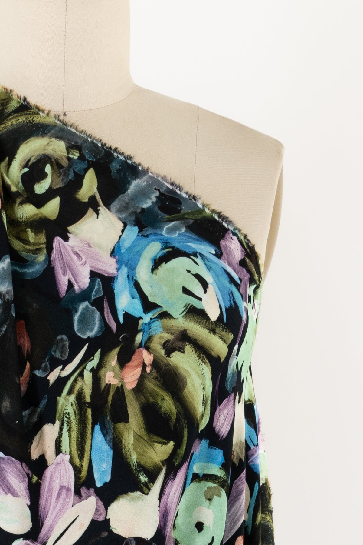 Vibrant floral print fabric on mannequin, ideal for apparel sewing and fashion projects