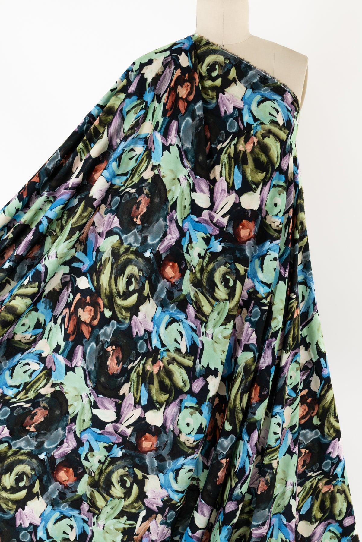 Vibrant floral print fabric with blue, green, and purple blooms on black background, ideal for apparel sewing