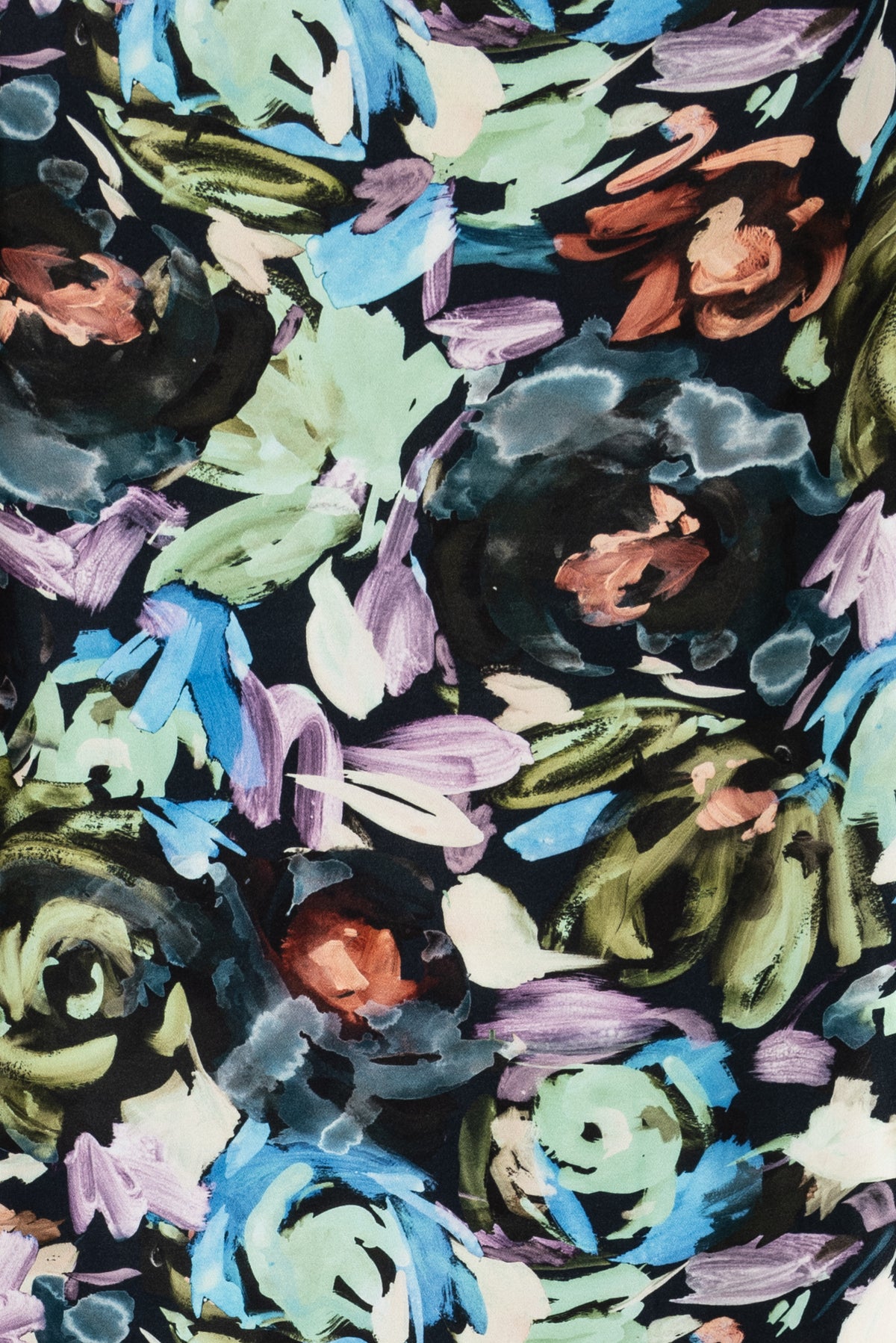 Vibrant floral print fabric with blue, green, purple, and rust tones on dark background, ideal for apparel sewing.