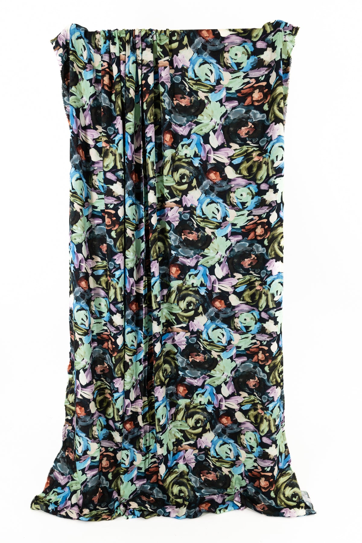 Vibrant floral print fabric with blue, green, and purple hues, ideal for apparel and sewing projects.