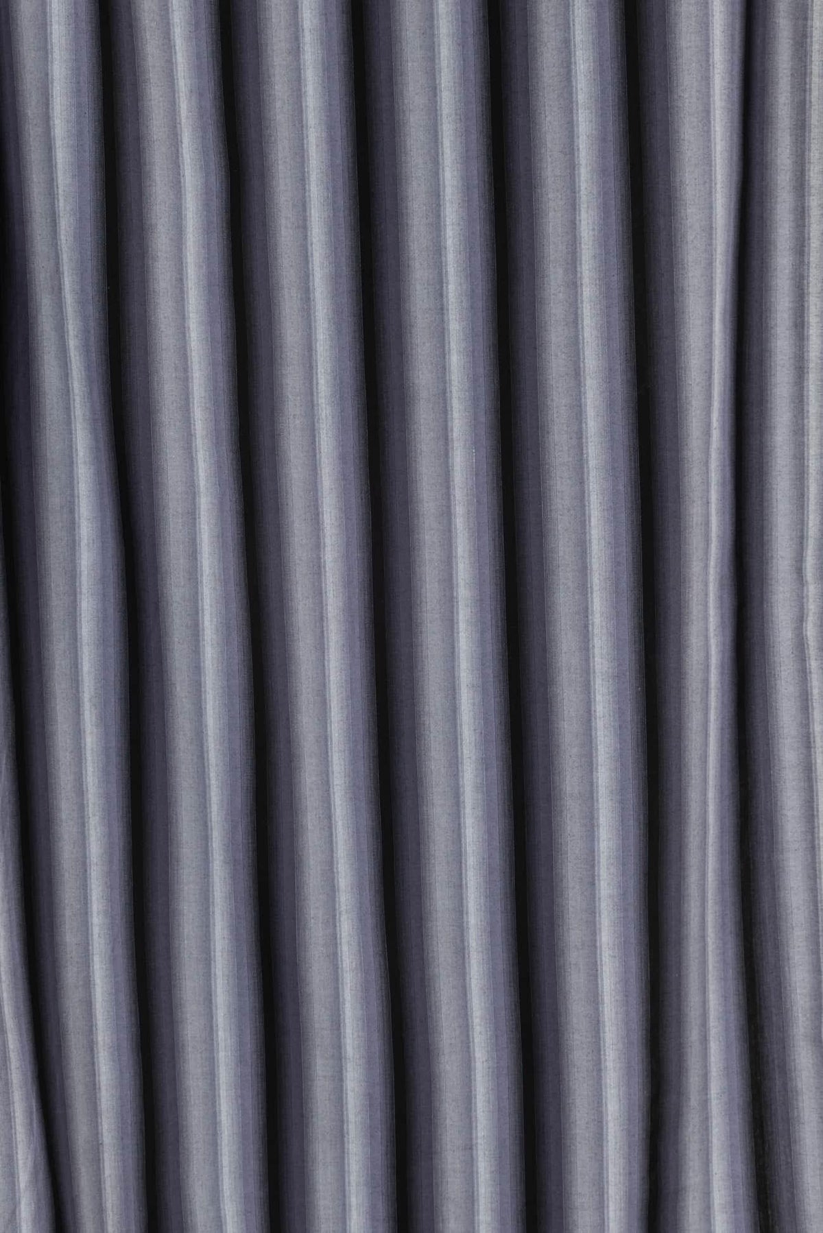 Gray striped woven fabric with soft texture, ideal for apparel and home decor sewing projects