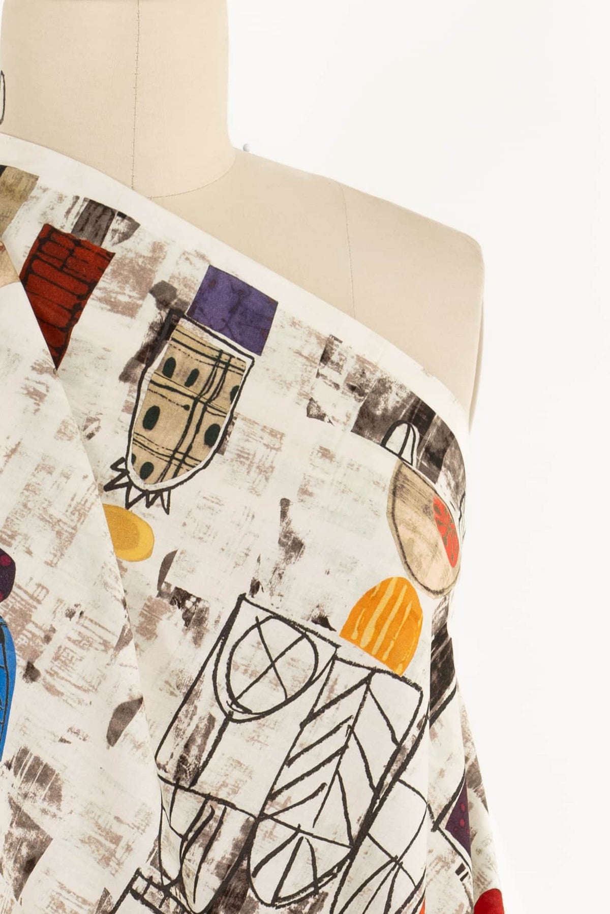 Abstract geometric print fabric on mannequin, ideal for apparel sewing and creative fashion projects