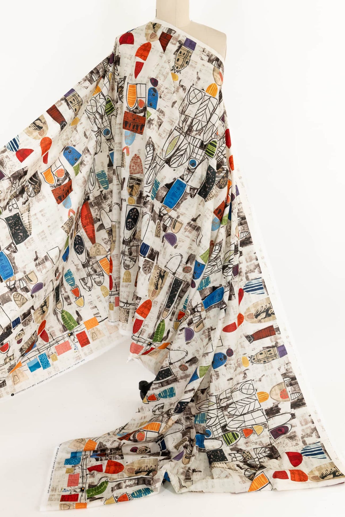 Colorful abstract print fabric with geometric shapes, ideal for apparel sewing and quilting projects