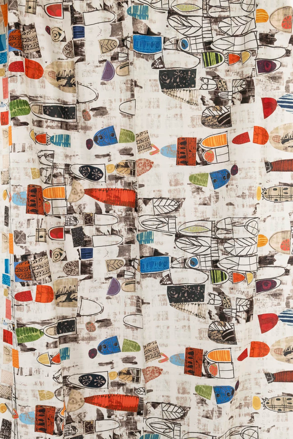 Abstract geometric print fabric with colorful shapes and patterns, ideal for apparel and quilting projects