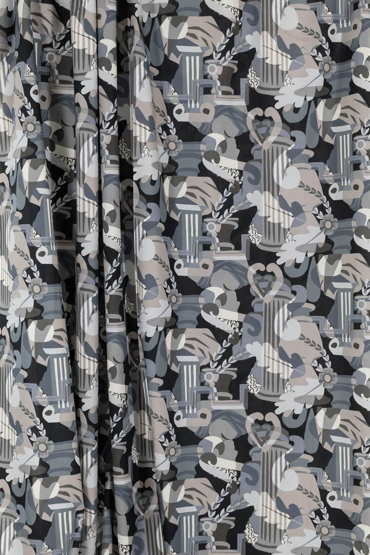 Abstract architectural print fabric in gray, white, and black — ideal for fashion, apparel, or quilting projects.
