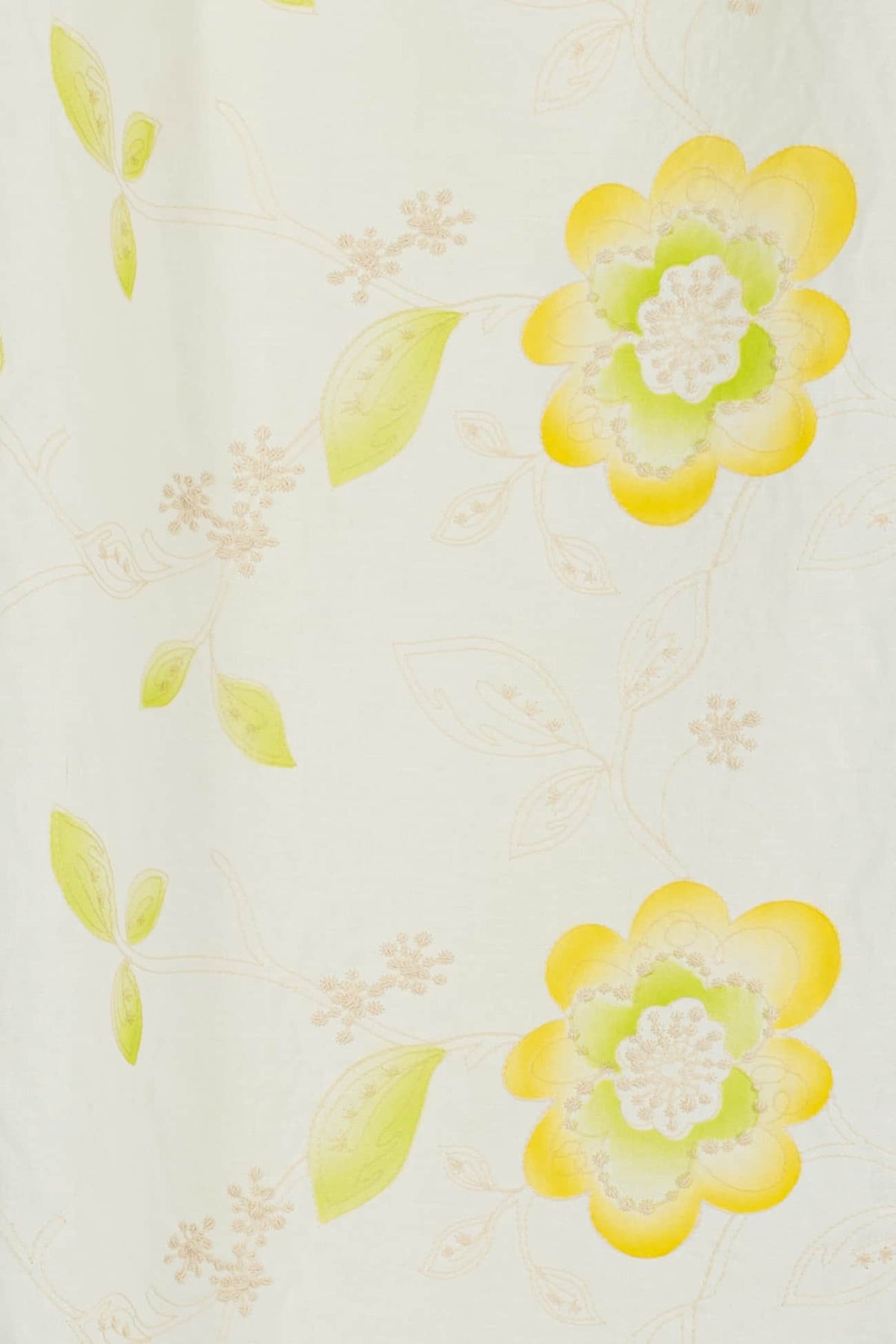 Yellow and green floral print fabric with delicate vines, ideal for apparel and quilting projects
