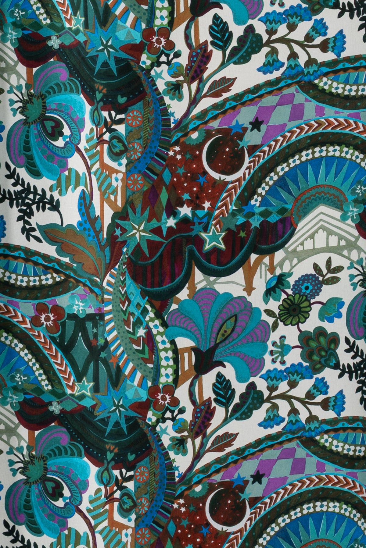 Vibrant floral and geometric print fabric with stars, paisley, and botanical motifs for apparel sewing