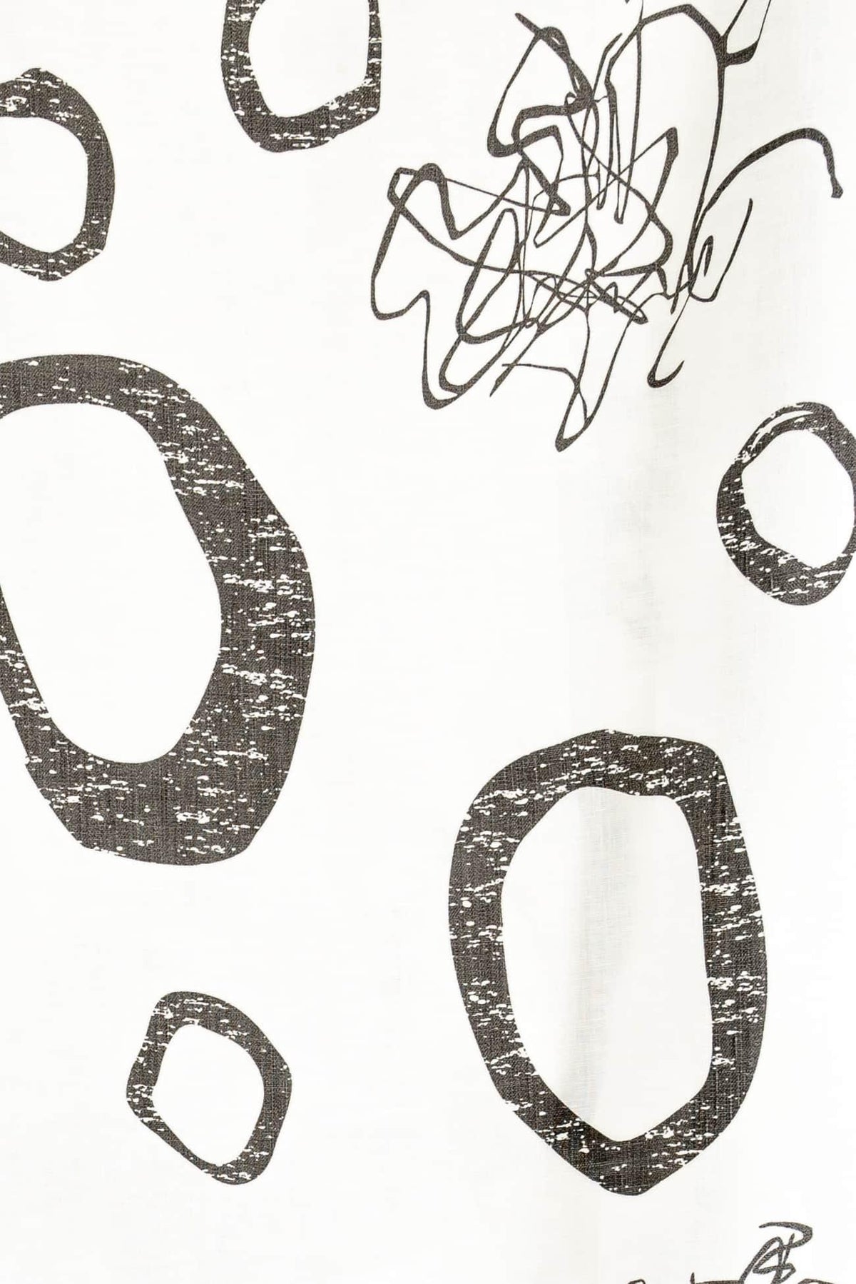 Abstract black and white fabric print with organic shapes and scribble design, ideal for apparel sewing