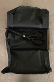 Black Merchant & Mills fabric scissors on tissue paper, ideal for sewing and cutting textiles