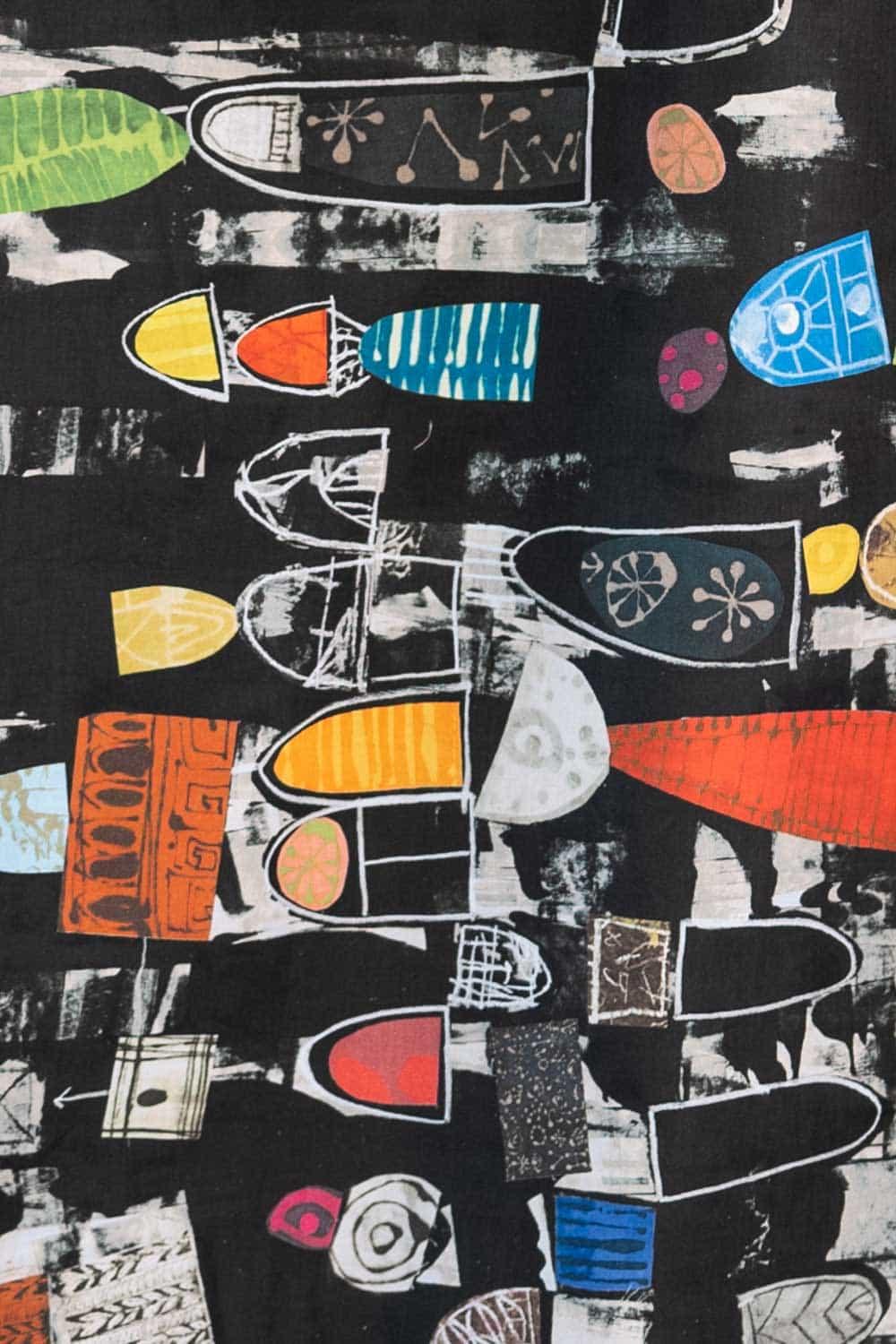 Abstract geometric fabric print with bold colors and shapes on black background, ideal for apparel sewing