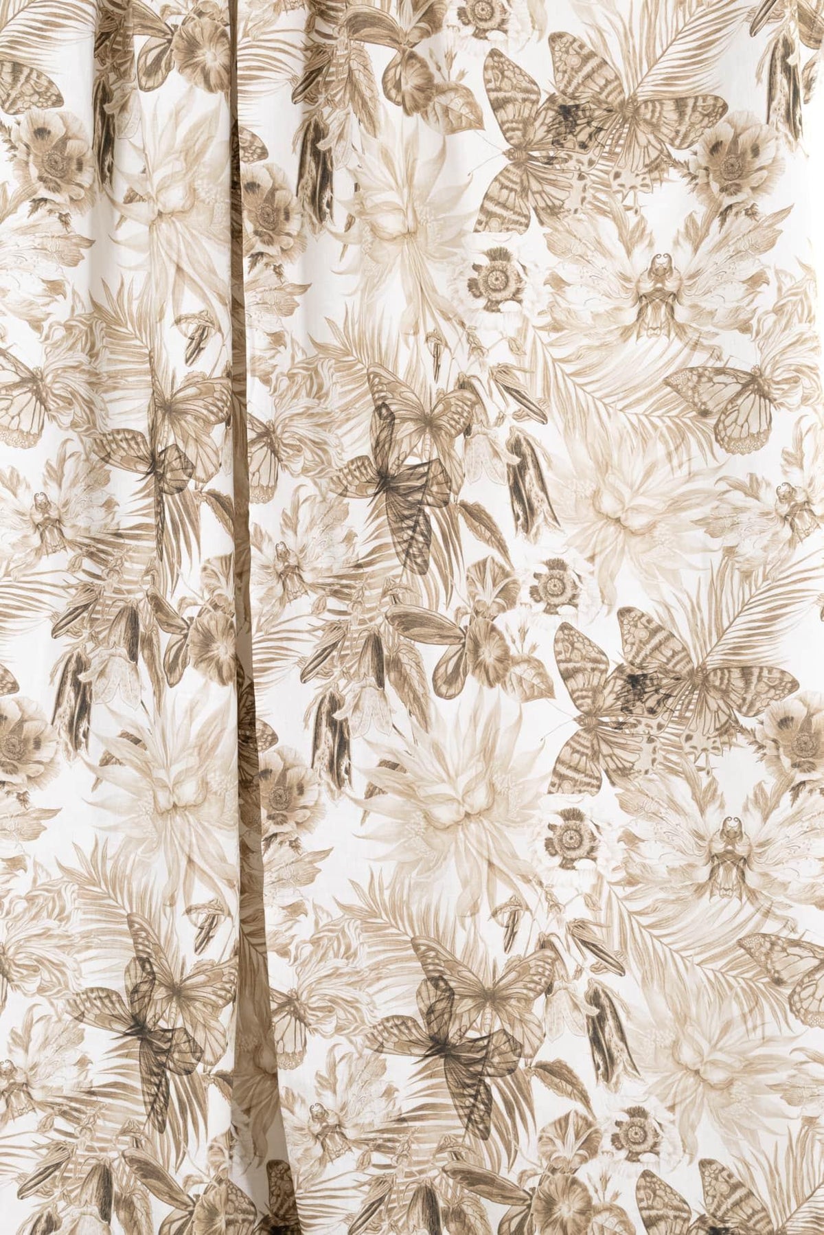 Floral and butterfly print fabric in earthy tones, ideal for apparel and quilting projects