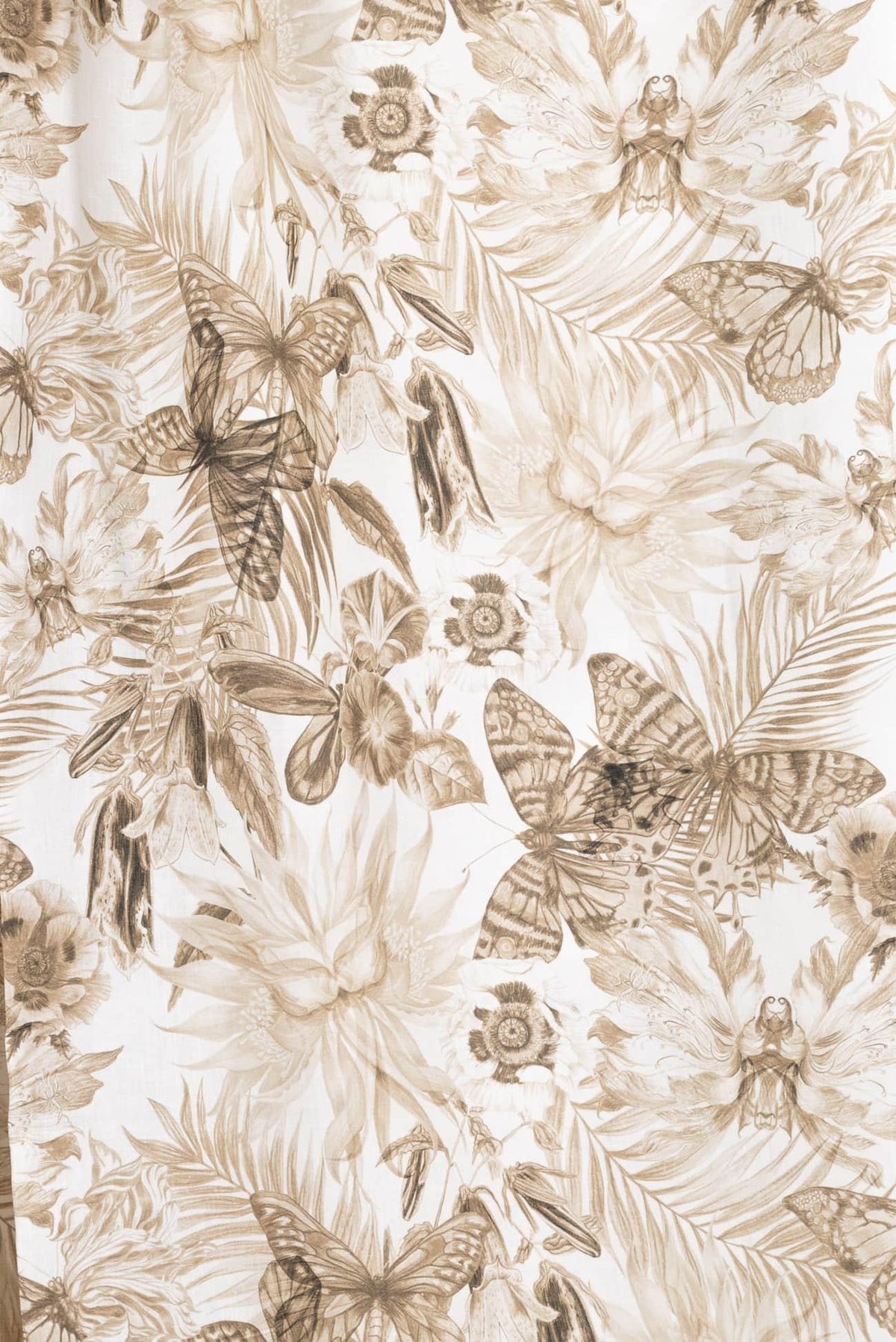 Elegant floral and butterfly print fabric in sepia tones, ideal for apparel and quilting projects