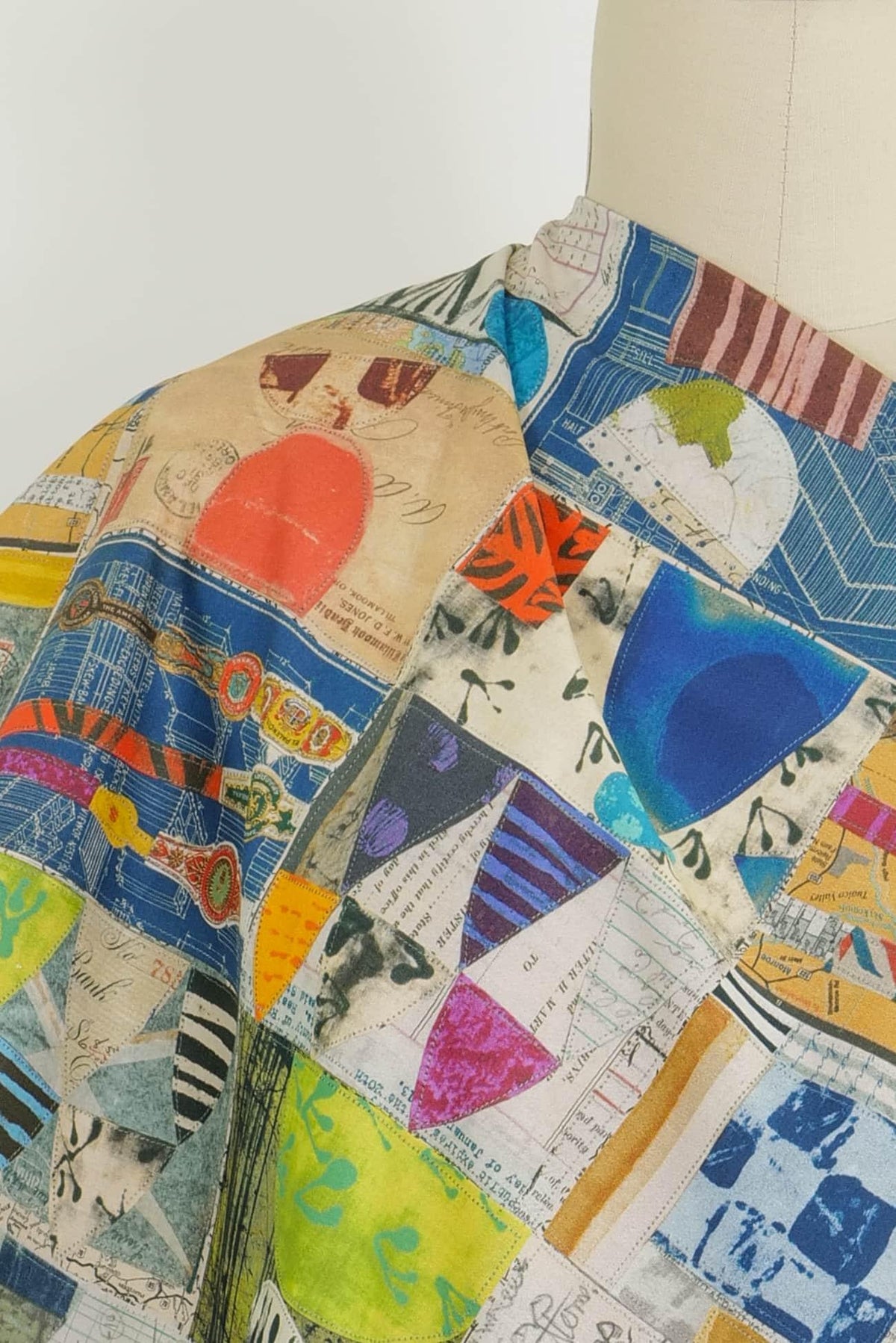 Colorful patchwork fabric with abstract prints, ideal for quilting and apparel sewing projects