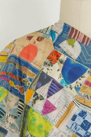 Colorful patchwork fabric with abstract prints, ideal for quilting and apparel sewing projects
