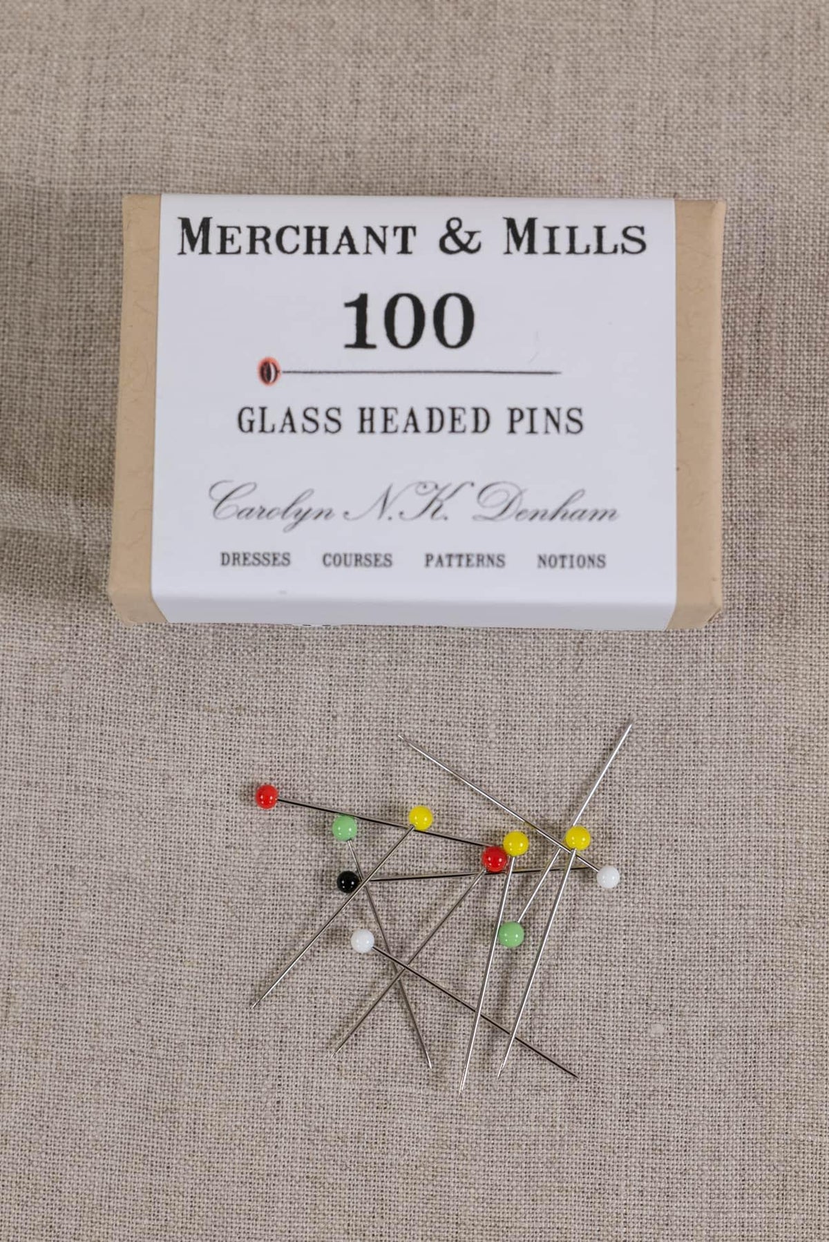 Merchant & Mills 100 glass headed pins for sewing, dressmaking, and quilting on linen fabric