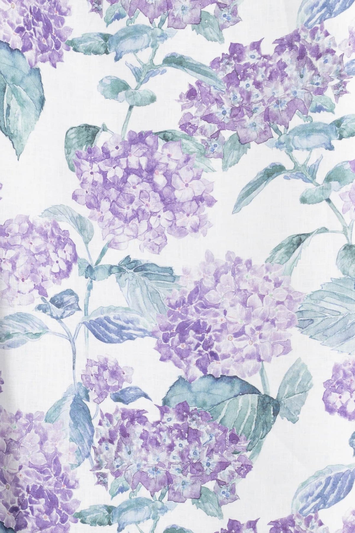 Purple hydrangea floral fabric print with green leaves on white background, ideal for apparel and quilting