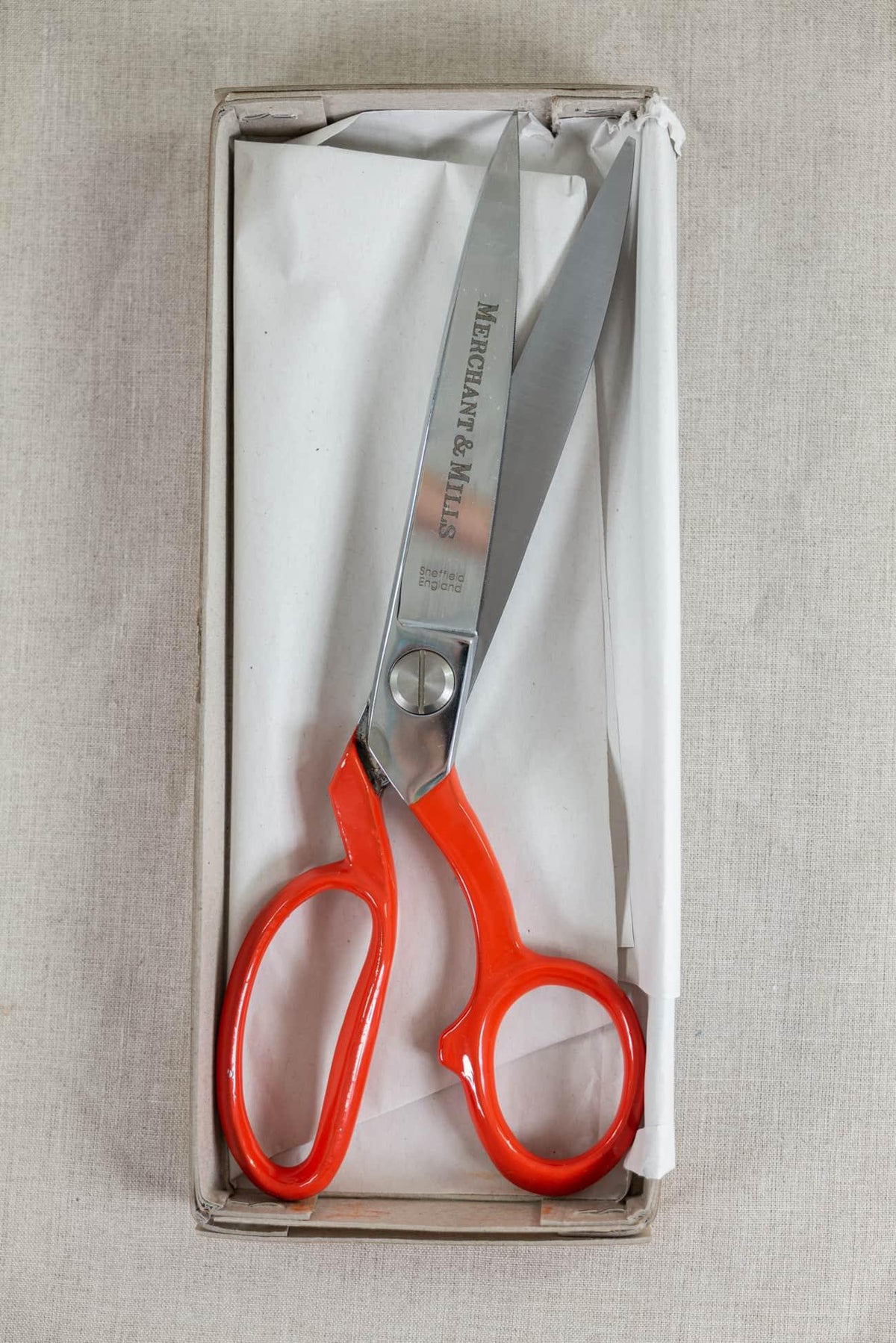 Merchant & Mills fabric scissors with orange handles in box, ideal for sewing and cutting textiles