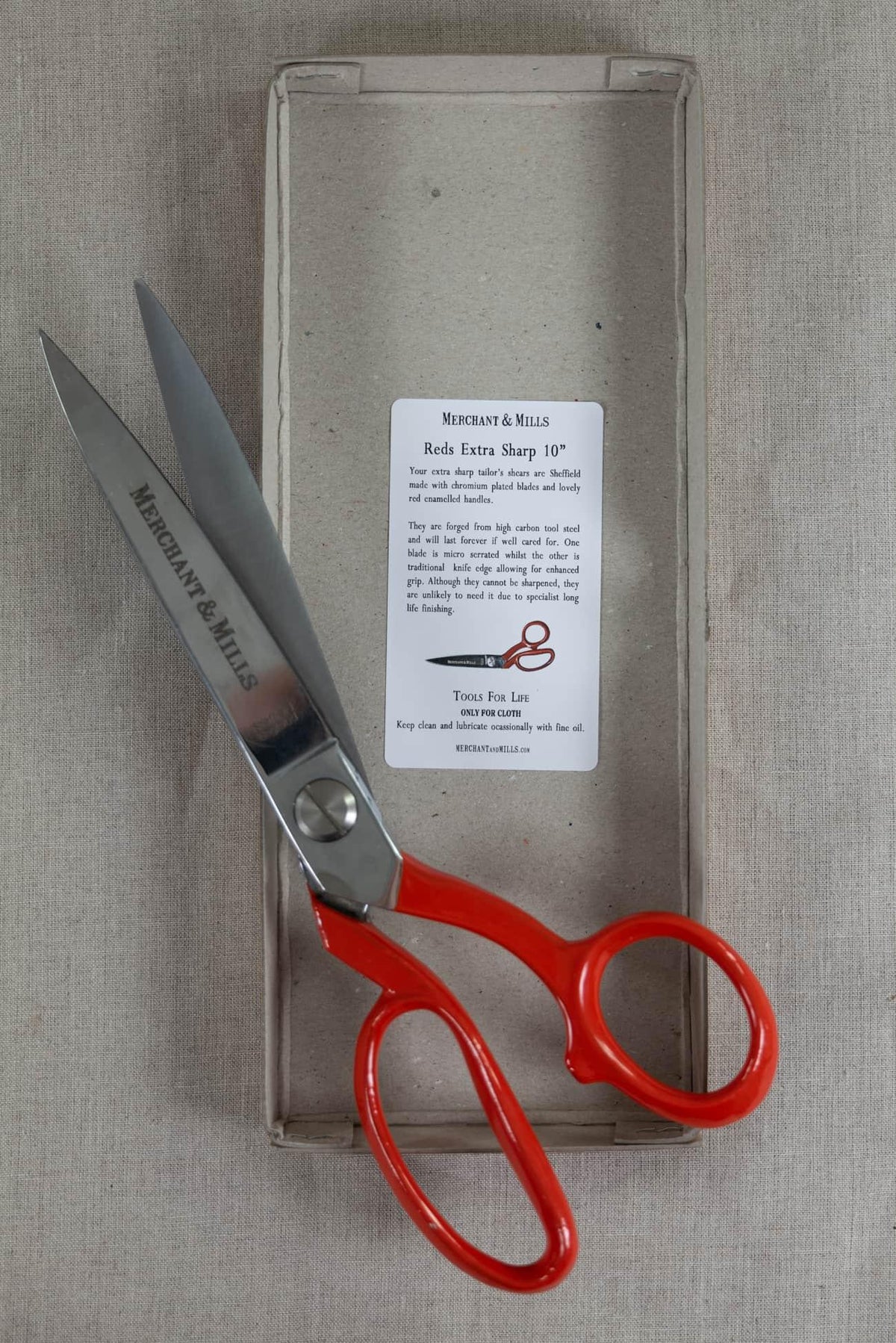 Merchant & Mills Reds Extra Sharp 10” tailor’s shears with red handles, ideal for cutting fabric and sewing projects.